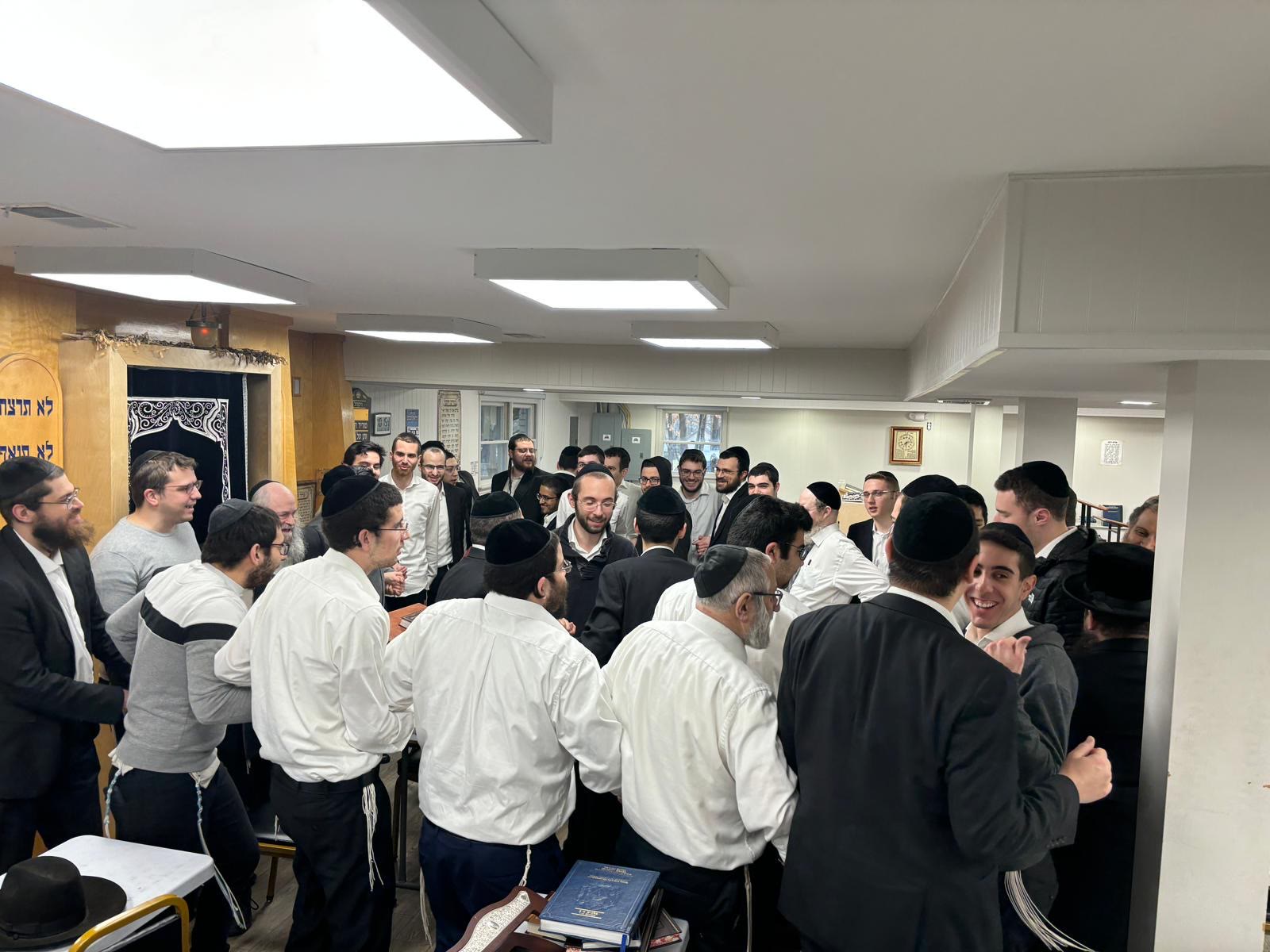 Talmidim standing and talking together in the beis medrash