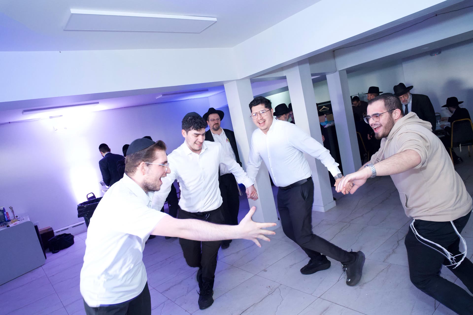 Talmidim dancing hand in hand