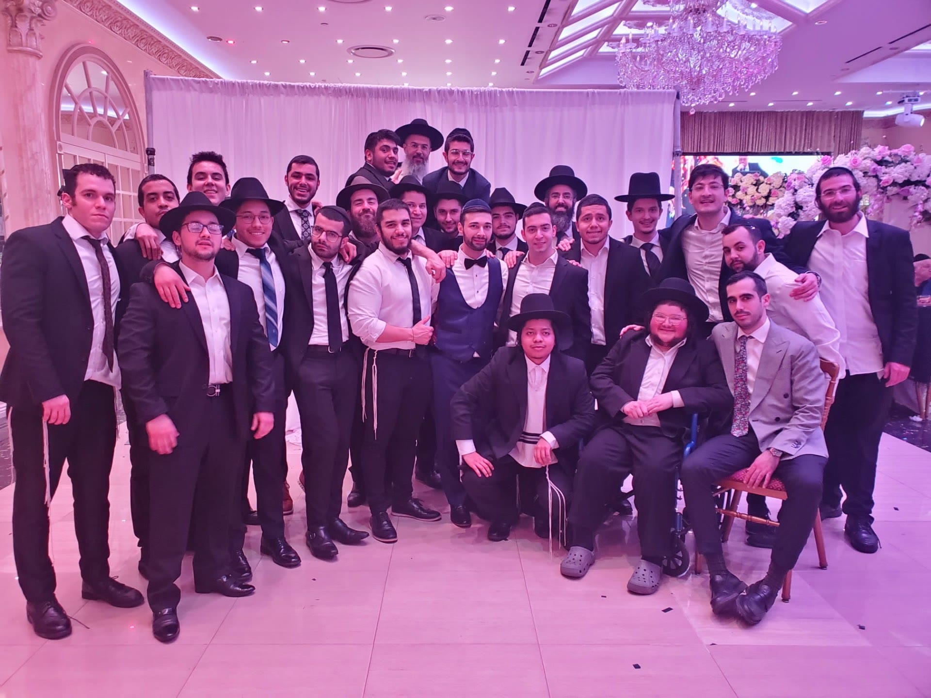 Talmidim posing together at a wedding